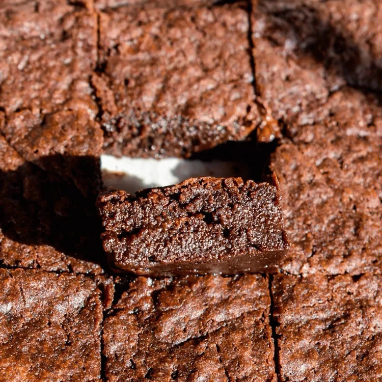 Close-up of Pamela's Products gluten-free chocolate brownie mix in a baking bundle, showcasing rich, fudgy brownies ready to bake.