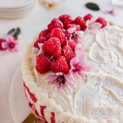 Gluten-free classic vanilla cake with frosting from Pamela's Celebration Baking Bundle, showcasing a freshly baked, decorated dessert.