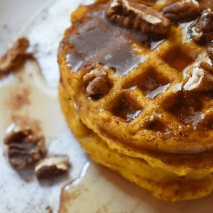 Pamela's Products gluten-free cornbread muffin mix with waffles and syrup in a bundle, showcasing baked goods and breakfast items.