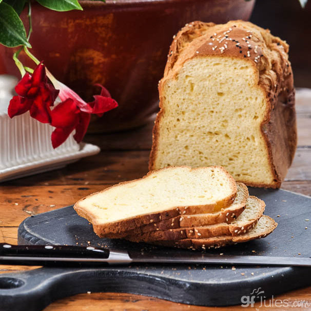 Slices of gfJules gluten-free bread made with gfJules bread mix, showing a soft, sliced loaf on a wooden surface.