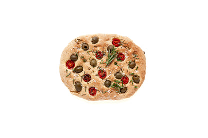 gfJules 10-Minute Gluten-Free Focaccia Mix in a bowl, ready to bake, with ingredients and baking utensils around it.