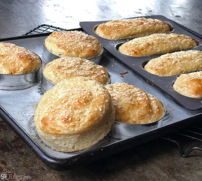 Gluten-free hamburger buns made with gfJules gluten-free bread mix, showcasing soft, golden buns on a wooden surface.