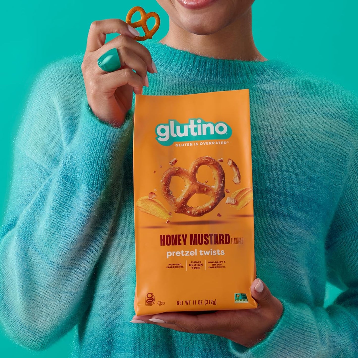 Glutino Honey Mustard Pretzels in a bowl, showcasing crunchy pretzels coated with honey mustard flavor on a rustic wooden table.