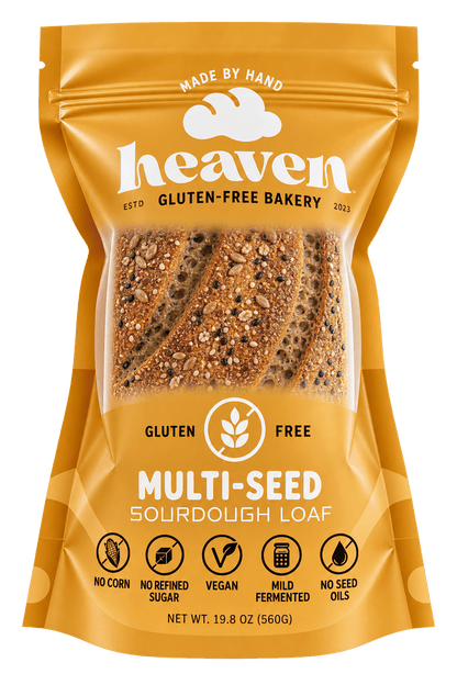 Four slices of Heaven GF Bakery vegan multi-seed sourdough bread, gluten-free and fresh in a 4-pack.