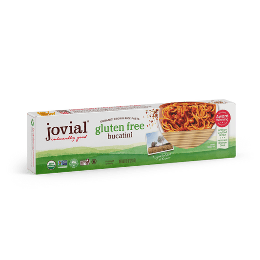 Jovial Gluten Free Brown Rice Bucatini pasta in a white bowl, showcasing the long, thin gluten-free brown rice pasta strands.