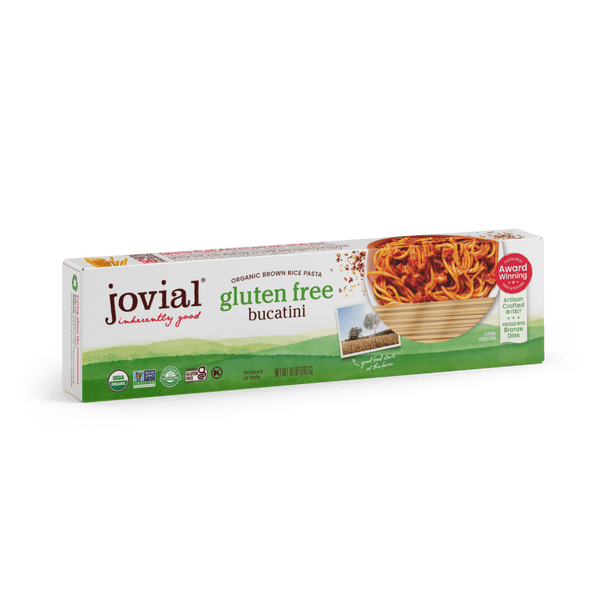 Jovial Gluten Free Brown Rice Bucatini pasta in a white bowl, showcasing the long, thin gluten-free brown rice pasta strands.