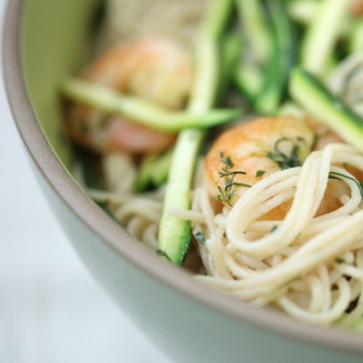 Gluten-free brown rice capellini pasta by Jovial Foods, Inc, shown cooked and ready to serve in a bowl.