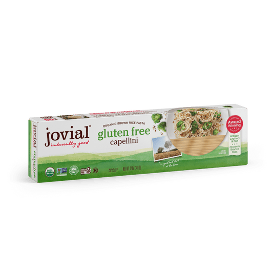 Jovial Gluten Free Brown Rice Capellini pasta in a clear bag, showing thin, light brown rice pasta strands ready for cooking.