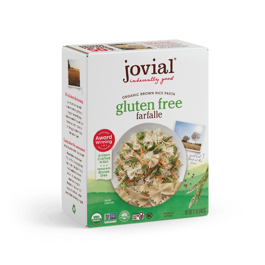 Jovial Gluten Free Brown Rice Farfalle pasta in a clear container, showing the bowtie-shaped brown rice pasta inside.