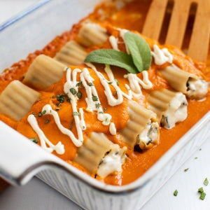 Jovial gluten-free brown rice manicotti pasta with pumpkin and sage filling, ready for cooking or serving.