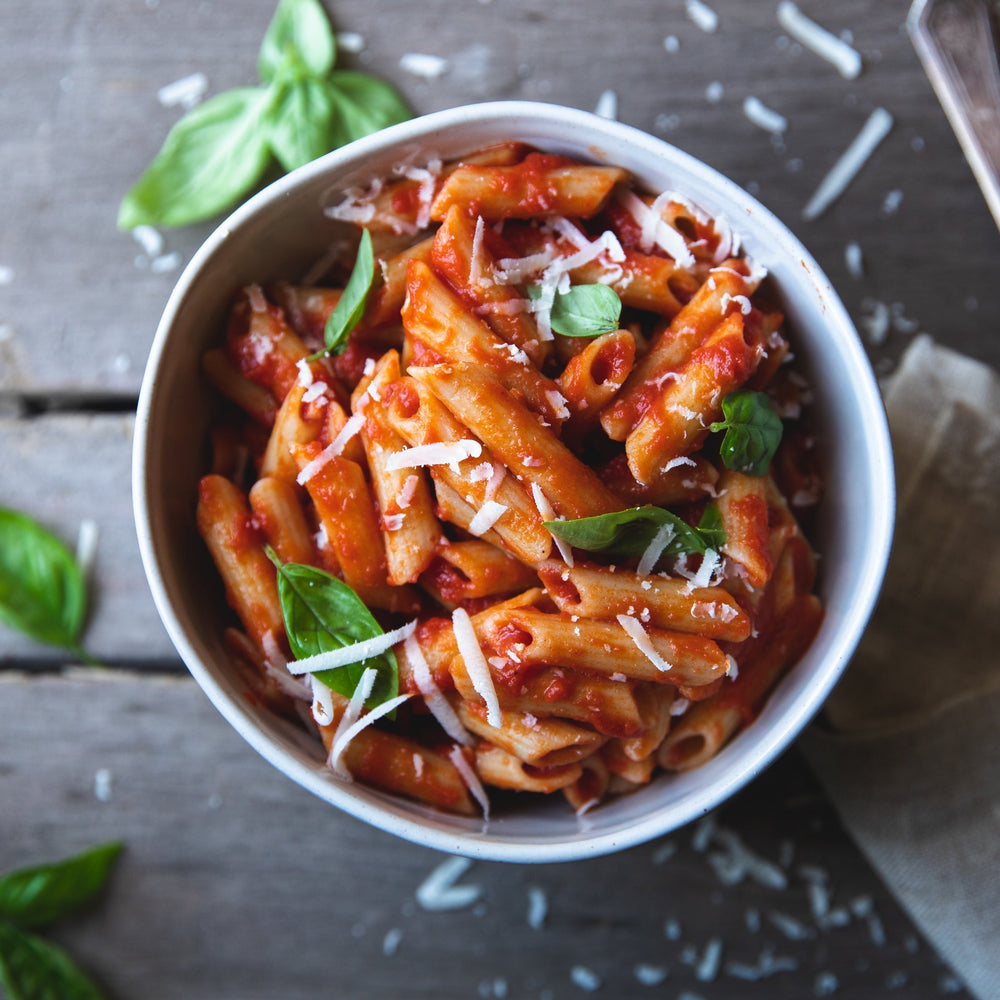 Jovial Gluten Free Rice and Lentil Penne Rigate pasta in a clear box, showcasing the gluten-free pasta shape and brand label.