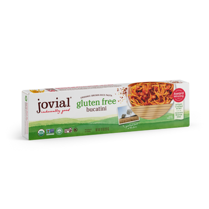Jovial Gluten Free Brown Rice Bucatini pasta in a white bowl, showcasing the long, thin gluten-free brown rice pasta strands.