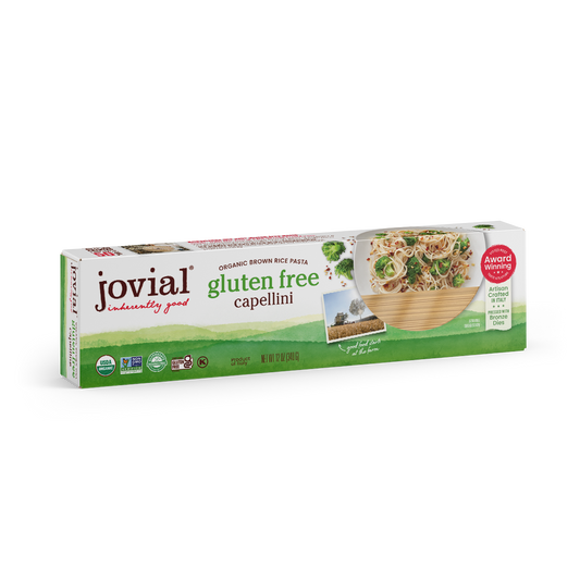 Jovial Gluten Free Brown Rice Capellini pasta in a clear bag, showing thin, light brown rice pasta strands ready for cooking.