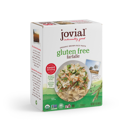 Jovial Gluten Free Brown Rice Farfalle pasta in a clear container, showing the bowtie-shaped brown rice pasta inside.