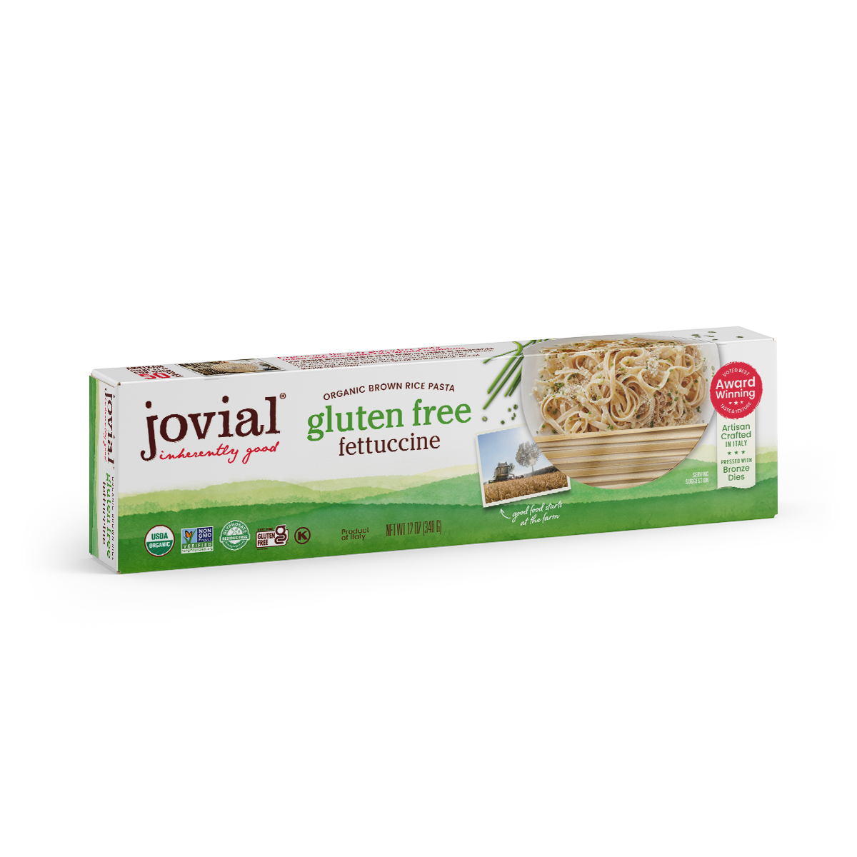 Jovial Gluten Free Brown Rice Fettuccine pasta, uncooked, showing long, flat noodles in a clear container with a white background.