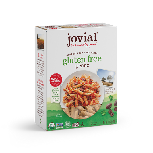 Jovial Gluten Free Brown Rice Penne Rigate pasta in a clear jar, showing the short, tube-shaped gluten-free pasta from Jovial Foods Inc.