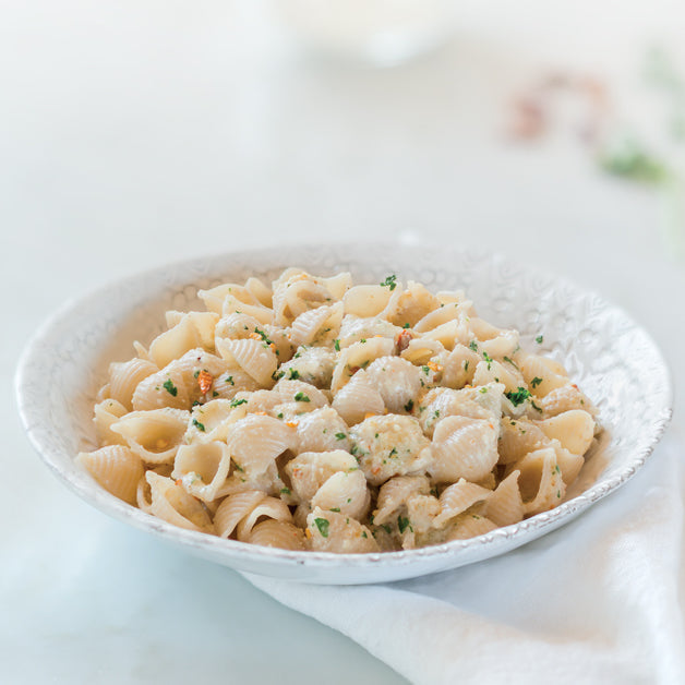 Jovial Gluten Free Brown Rice Shells packaging with a clear view of the pasta inside, highlighting the Jovial Foods Inc brand.