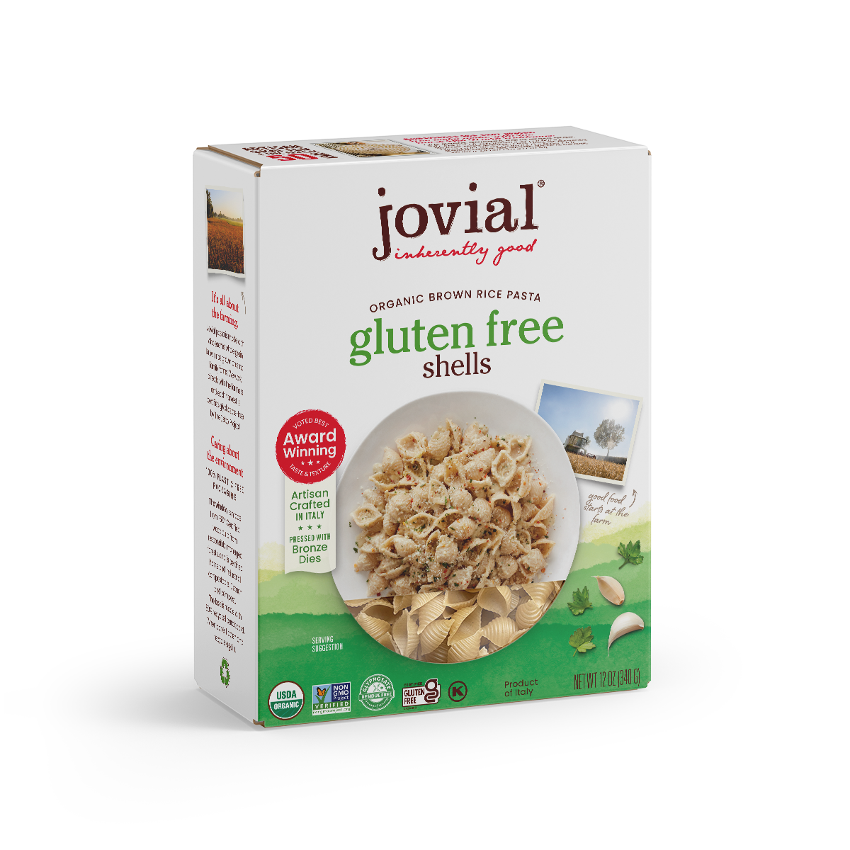 Jovial gluten free brown rice shells in a clear jar, showing the light brown, shell-shaped rice pasta on a white background.
