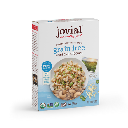 Jovial Grain-Free Cassava Elbows pasta in a silver silo, showing the uncooked, orange-tinted cassava pasta shape in a clear view.