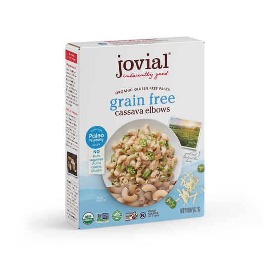 Jovial Grain-Free Cassava Elbows pasta in a silver silo, showing the uncooked, orange-tinted cassava pasta shape in a clear view.