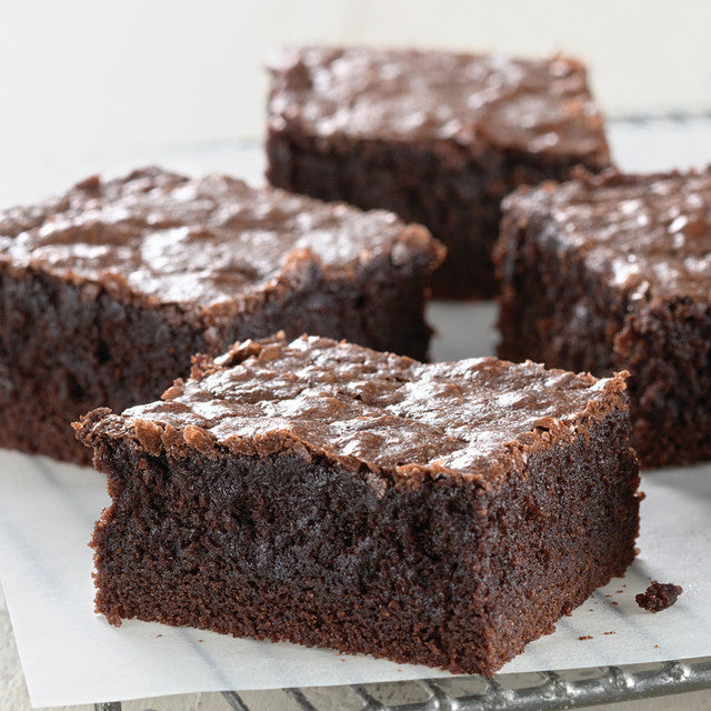 King Arthur gluten-free fudge brownie mix in a box, showing the packaging with chocolate brownies and baking instructions.