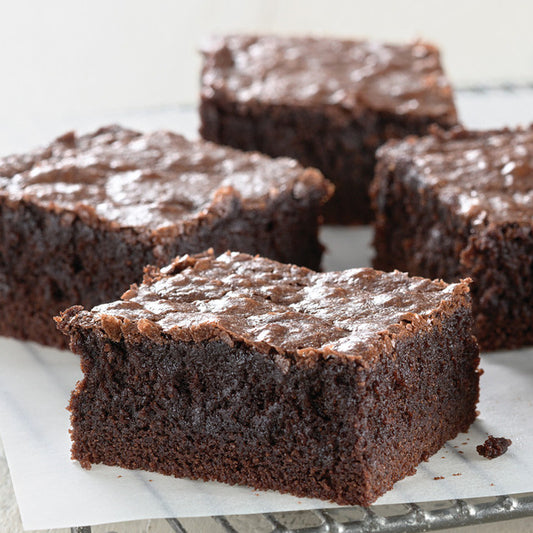 King Arthur gluten-free fudge brownie mix in a box, showing the packaging with chocolate brownies and baking instructions.