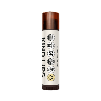 Four tubes of Kind Lips Organic Lip Balm in a variety pack, featuring colorful packaging and natural ingredients for soft, moisturized lips.