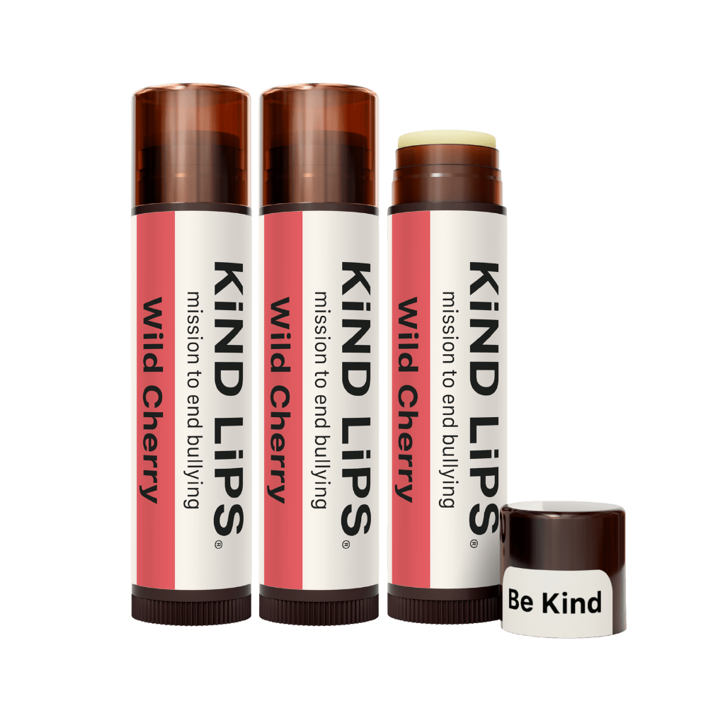 Kind Lips Wild Cherry Organic Lip Balm featuring a smooth, natural lip balm tube with cherry-flavored packaging and branding.