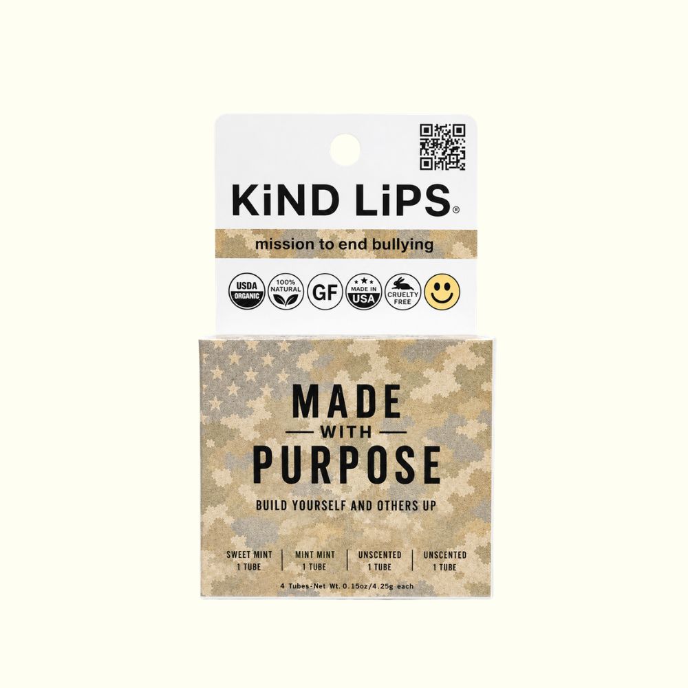 KiND LiPS packaging box featuring a white top card with a QR code and product info, and a lower section with a beige and brown star-patterned background and the text 'MADE WITH PURPOSE'.