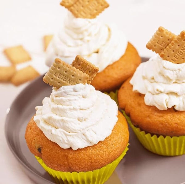 Love Me Gluten Free Leibniz Minis gluten-free cupcakes in paper cups, showcasing small, bite-sized dessert treats.