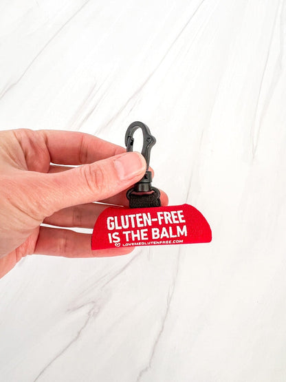 Love Me Gluten Free lip balm holder keychain with colorful silicone design and attached metal keyring for easy carrying.