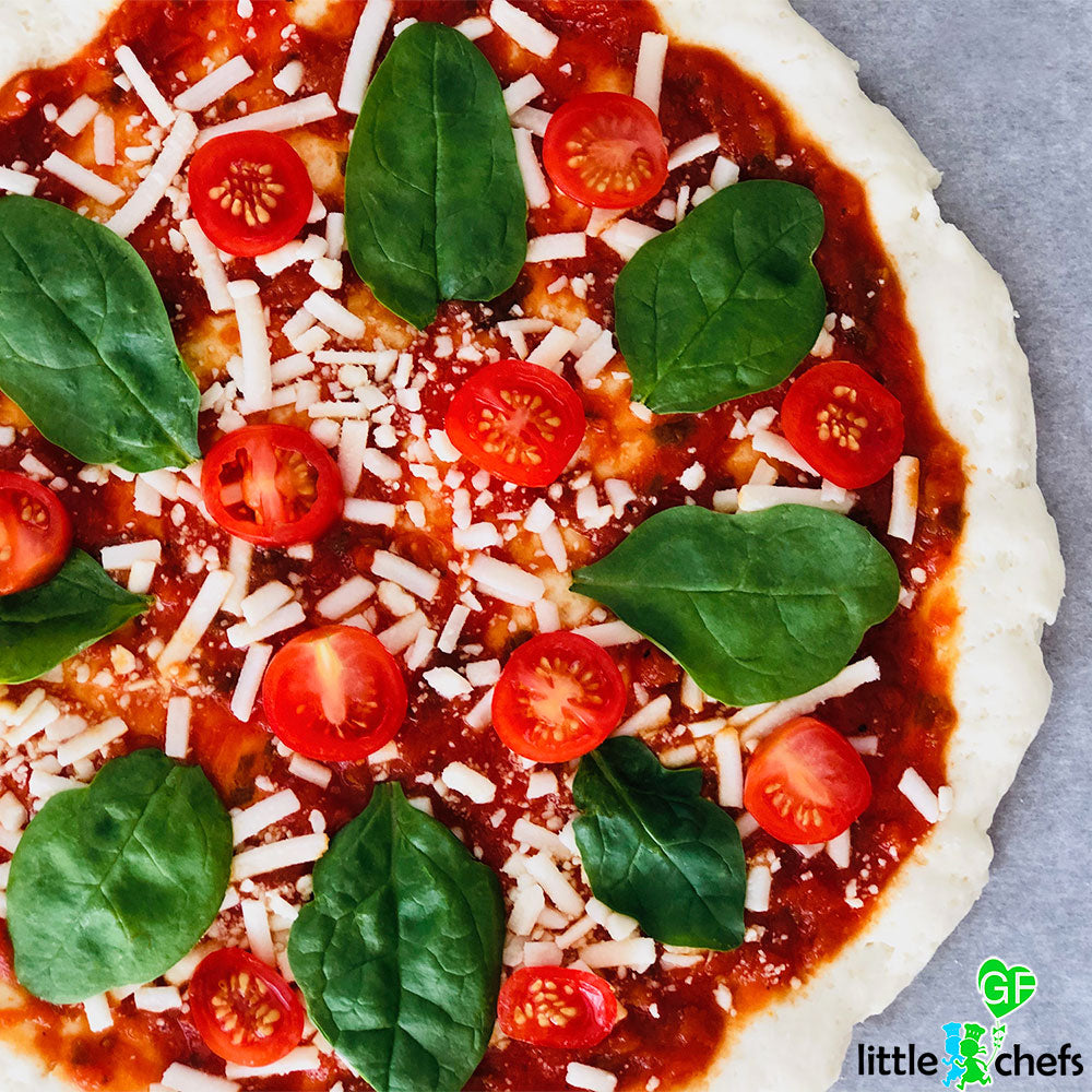 Little GF Chefs Pizza Party Kit including mini pizza bases, toppings, and cooking tools for kids' fun cooking activities.