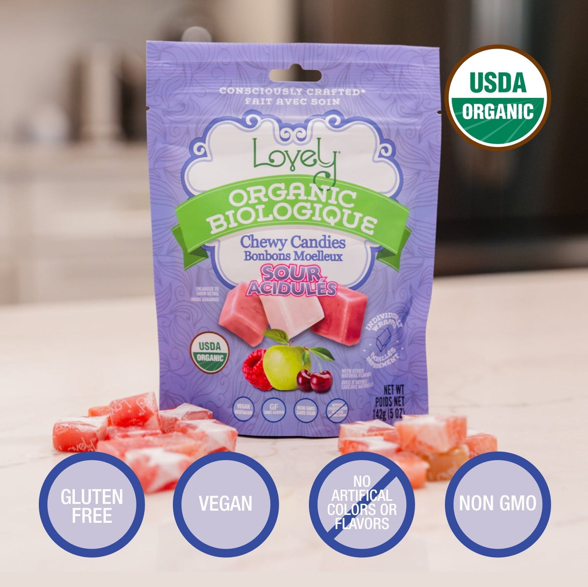 Organic sour chewy candies by Lovely Candy Company featuring colorful fruit flavors and vibrant packaging.