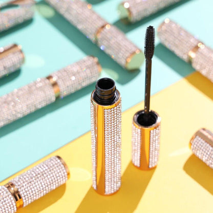 EpiLynx Mega Volume Vegan Mascara with handmade diamond case, showing the smudge-proof formula and full brush applicator.
