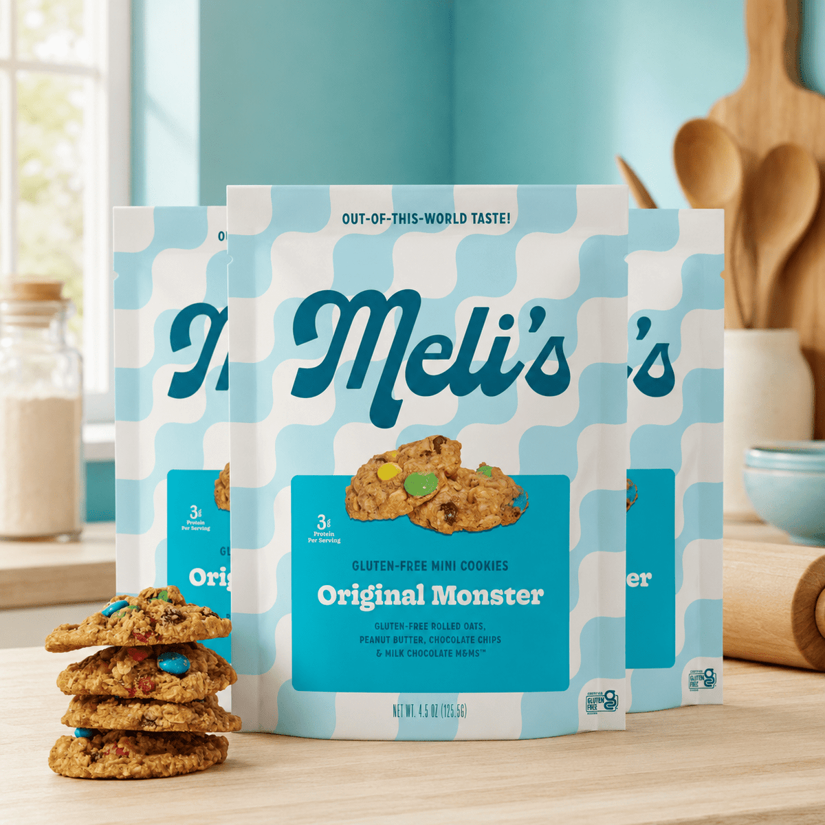 Three packs of Meli's Cookies Original Monster Mini Cookies showing colorful packaging and small chocolate chip cookies inside.