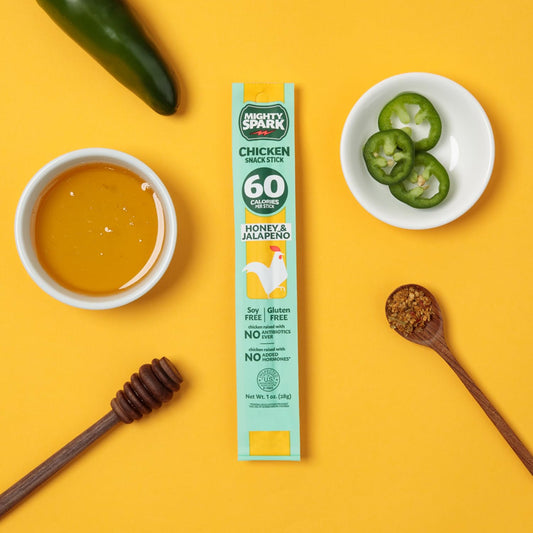 Mighty Spark Chicken Snack Sticks in Honey & Jalapeno flavor, 12-pack, showing the snack sticks and packaging on a white background.