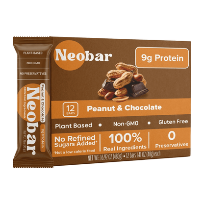 A box of Neobar Peanut & Chocolate protein bars with one bar displayed in front on a clean white background. The packaging is predominantly brown with orange accents and white text, featuring a photo of peanuts, chocolate, and nuts on the front.