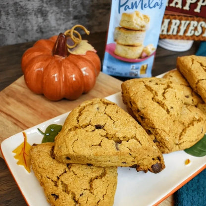 Pamela's Products savory baking bundle featuring biscuit and scone mixes, golden baked scones and biscuits on a rustic surface.