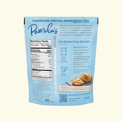 Pamela's gluten-free hot honey drop biscuit mix bundle showing assorted biscuit packages and ingredients on a wooden surface.
