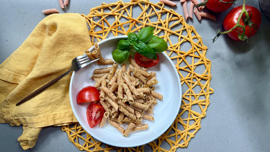 Six packs of Flower Chef Foods artisanal gluten-free, high-protein penne pasta displayed in a clear view.