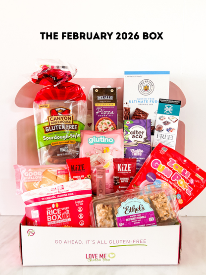 Love Me Gluten Free February 2026 Box with assorted gluten-free snacks and treats arranged in a decorative box.