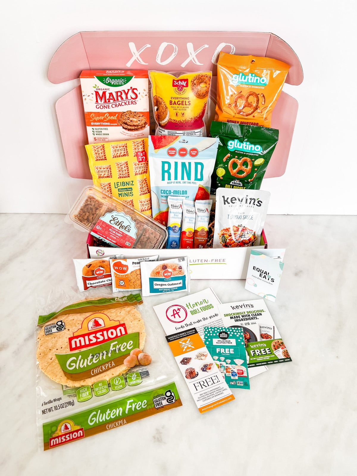 Love Me Gluten Free dairy-free and gluten-free monthly subscription box with assorted snacks and treats.