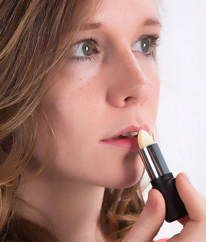 Red Apple Rallye Balm by Red Apple Lipstick, featuring a sleek red tube and the balm's smooth, glossy finish.
