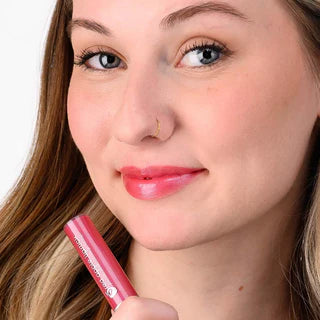 Red Apple Lipstick Gemazing Kate lip gloss in vibrant red, showcasing its glossy finish and smooth applicator.