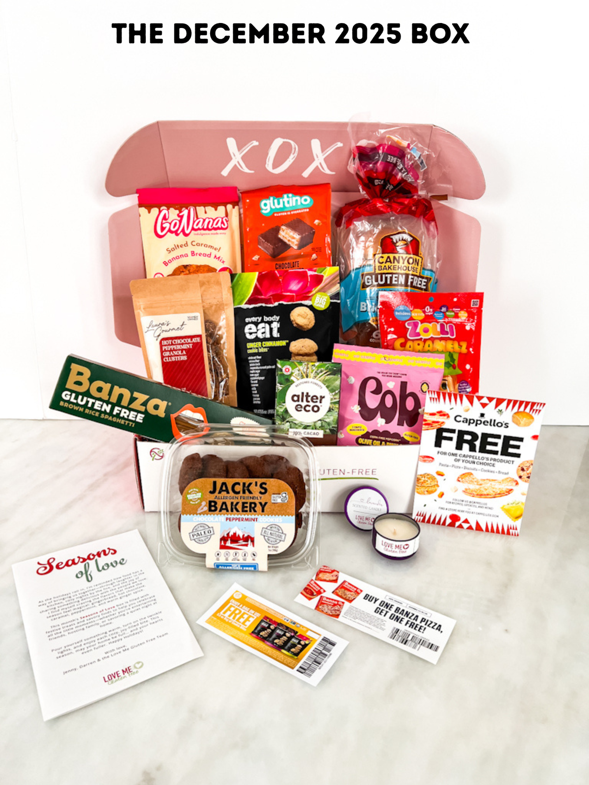 Love Me Gluten Free Signature Monthly GF Box for December 2025 with assorted gluten-free treats and snacks inside.