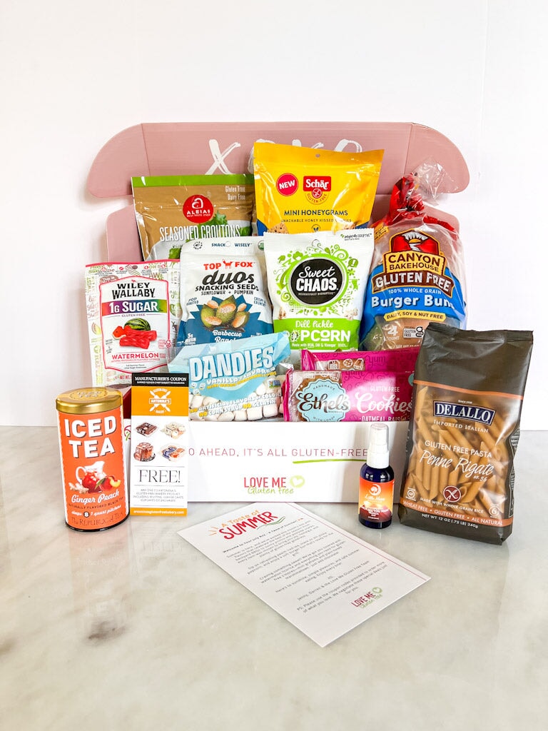 Love Me Gluten Free dairy-free and gluten-free monthly subscription box with assorted snacks and treats, July 2025 edition.