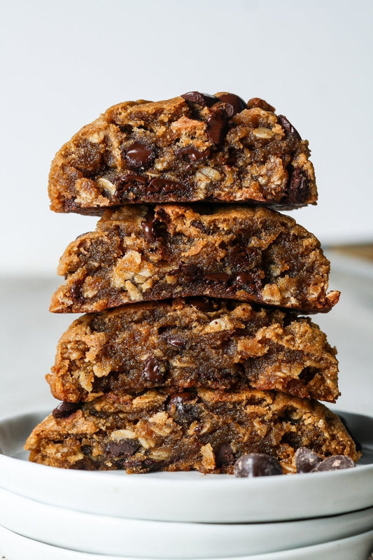 Sweet Addison's oatmeal chocolate chip cookies on a plate, showing golden-brown cookies with chocolate chips and a soft texture.