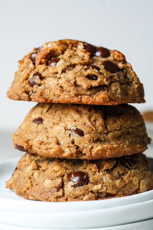 Sweet Addison's oatmeal chocolate chip cookies on a plate, showcasing golden-brown cookies with chocolate chips and chewy texture.
