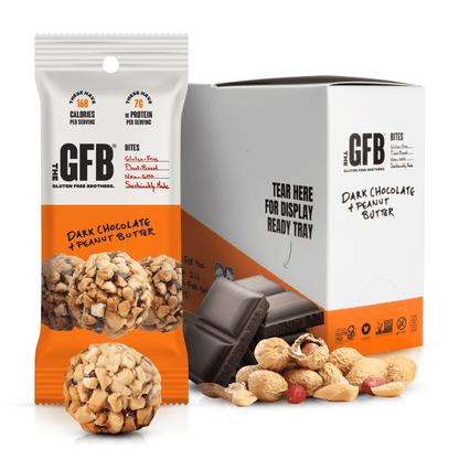 The GFB Dark Chocolate Peanut Butter Bites in a clear bag, showing the small, round bites coated with dark chocolate and peanut butter filling.