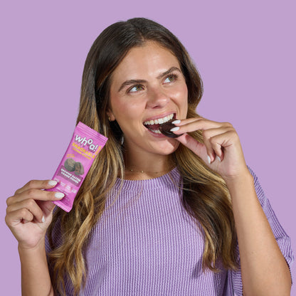 Snackable brownie batter cookie dough by Whoa Dough, 14-pack, with soft, chocolatey dough visible in a clear tray.